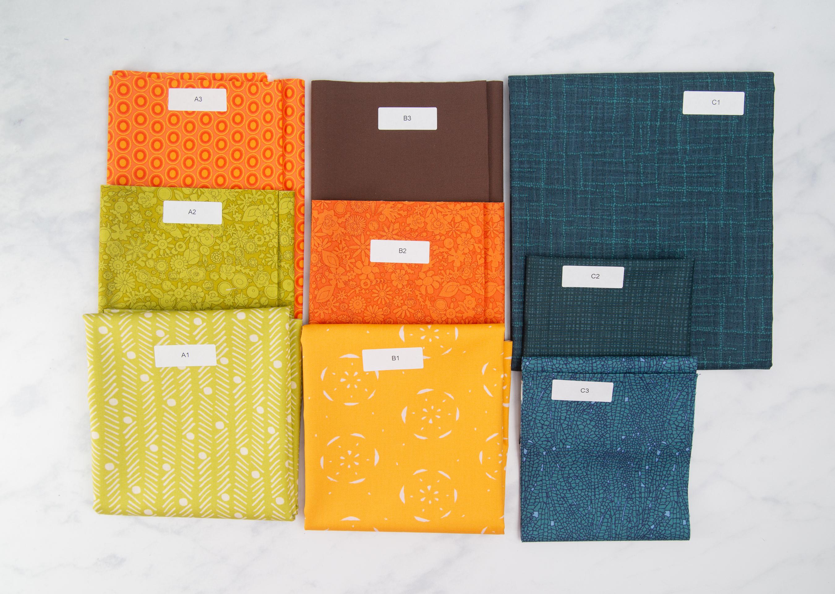 Upscale Plaid Quilt Kit | Includes Pattern by Lo and Behold Stitchery | 67in x 67in Throw Size Quilt Kit | Green, Orange, Blue colorway